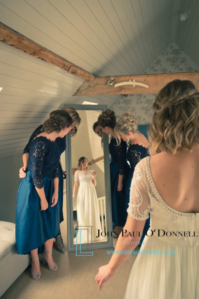 Bride showing guests dress